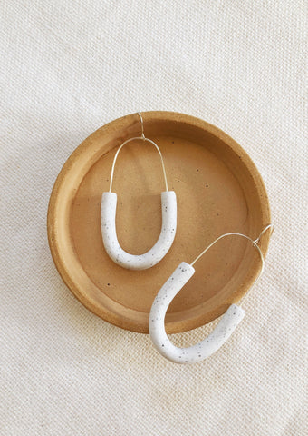 Studio Toujours - modern minimalist earrings made with polymer clay. Has a concrete texture and suspended on sterling silver plated earring hooks.